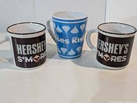 Three Hershey's ceramic mugs front view
