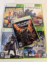 Front view of all five Xbox 360 game cases