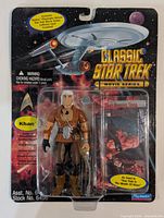 Front of sealed Khan Noonien Singh action figure card showing figure and accessories