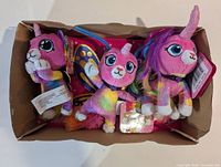 All three plush keychains in box