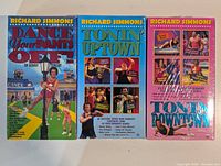 Front view of three sealed Richard Simmons VHS tapes