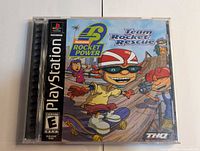 Front of sealed jewel case showing cover art and PlayStation branding