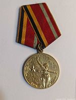 Front view of medal with ribbon attached