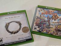Front covers of The Elder Scrolls Online Tamriel Unlimited and Sunset Overdrive cases