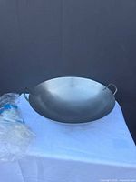 Full view of carbon steel wok on table