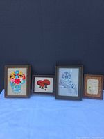 Group shot of all four framed artworks