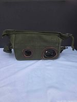 Canvas carrying case side view showing leather-reinforced grommets