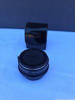 Teleconverter front with case in background