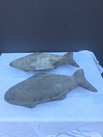 Two fish-shaped cast metal dishes top view