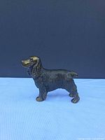 Right side profile of cast metal Cocker Spaniel figurine