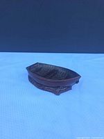 Perspective view of cast metal rowboat ashtray