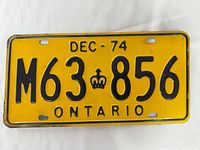 Front view of yellow Ontario DEC-74 M63-856 plate