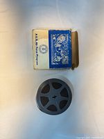 Front of box labelled A.U.S. Air Force Program with film reel beside