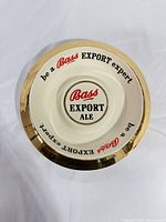 Top view showing Bass Export Ale graphics and gold rim