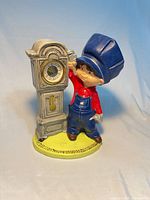 Front view showing figurine and clock face