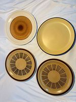 Top view of four plates showing patterns and colors