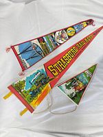 Three pennants showing graphics and colors