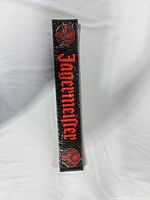 Front view of sealed Jägermeister bar mat showing logo and emblems