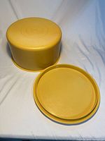 cake carrier upside-down with lid beside