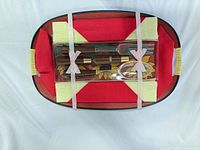Top view of tray with packaged servers and shakers strapped inside