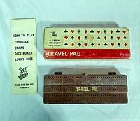 Outer cardboard box, closed plastic case cribbage board, instruction leaflet