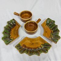 Top view of all five ceramic pieces showing shapes and glaze