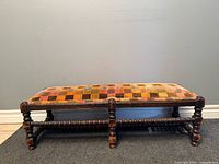 Front view showing entire bench, turned legs and barley-twist stretcher