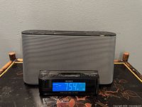 Front view showing Sony ICF-CS10iP Dream Machine clock radio with blue LCD display