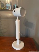 Front angled view showing entire lamp, adjustable column, base, cord