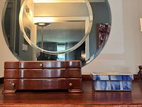 Wooden jewelry box and stained glass box side by side