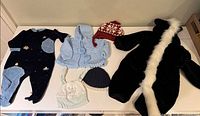 All six clothing items laid out on table