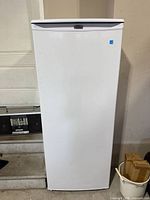 Full front view of upright freezer