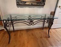 Full view of console table with glass top and metal base