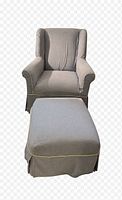 Front view of wingback armchair and ottoman showing overall style and matching fabric