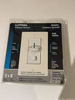 Front of sealed Lutron Skylark S-603PH-WH dimmer blister pack showing 600-watt rating and white finish