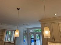 Both pendant lights hanging from ceiling in kitchen