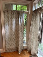 Curtain panels hung on windows showing color and pattern