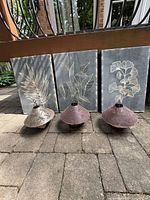 three rust-finish dragonfly lanterns front view