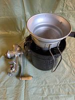 Full lot showing meat grinder, aluminum colander and perforated pot