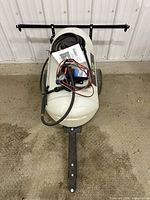 Complete sprayer top view showing tank, frame, boom, hose, wiring and manual