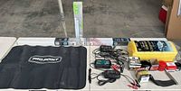 Full lot overview showing chargers, mat, towels, oil filters, accessory boxes