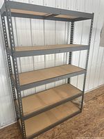 Front view of full shelving unit showing five shelves and steel frame