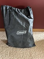 Coleman branded storage bag containing air mattress