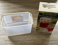 CreativeWare beverage dispenser box beside nested IRIS baskets