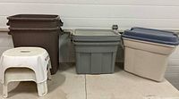 Two brown bins, grey tote with lid, beige tote with blue lid, white step stool