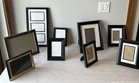 Front view showing all nine frames in varying sizes and finishes