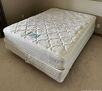 Queen mattress and box spring on metal frame