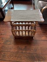 Front view showing tabletop and magazine rack