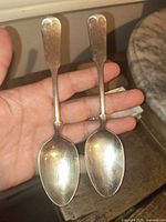 Front view of both spoons showing bowls and handle design