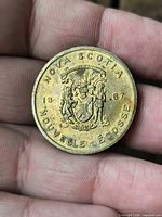 Obverse showing Nova Scotia coat of arms, date 1867, bilingual legend